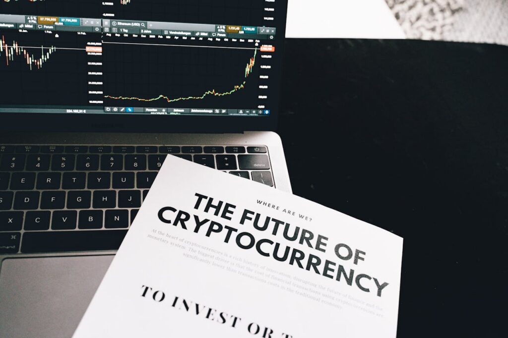 A detailed look at cryptocurrency market trends using a laptop and analytical document.